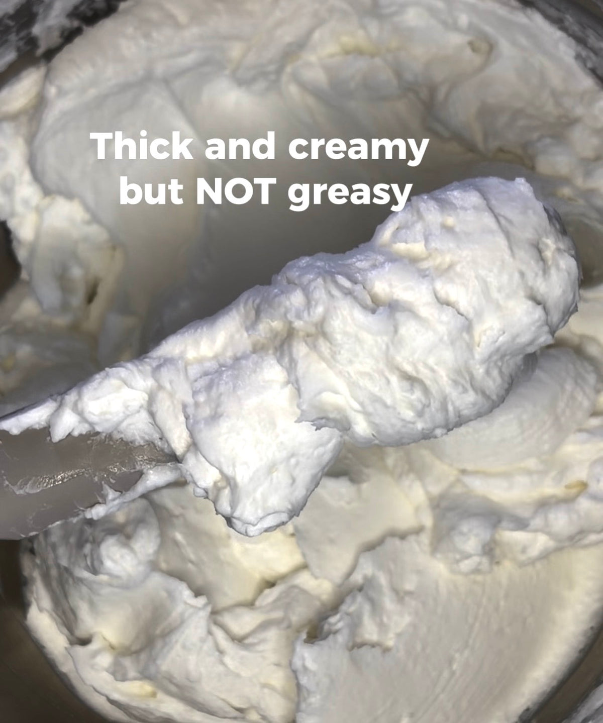 Unscented body butter cream with thick white whipped texture