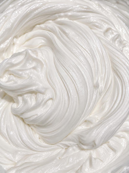Whipped body butter with smooth white cream swirled texture